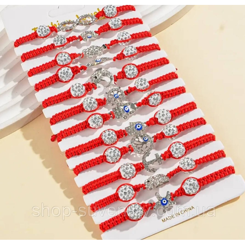 Брослет на руку з яскравими кулонами 